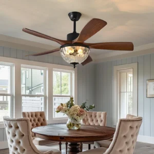 Radar ceiling fan light installed in formal American dining room, walnut wood blades with dimpled glass shade, upward angled view