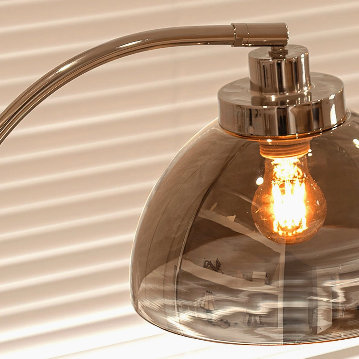Close-up detail of Radcliff lamp dome shade showing smoked glass and vintage Edison filament bulb