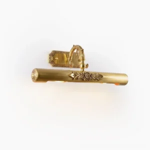 Radcliffe Brass Wall Sconce front three-quarter view showing ornate floral relief engravings and curved decorative arm