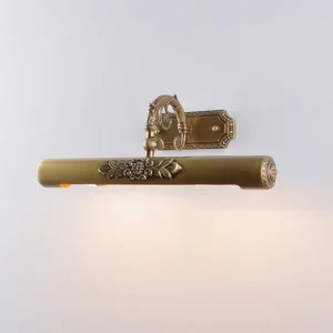 Radcliffe Brass Wall Sconce top view displaying decorative bordered backplate and embossed floral motifs