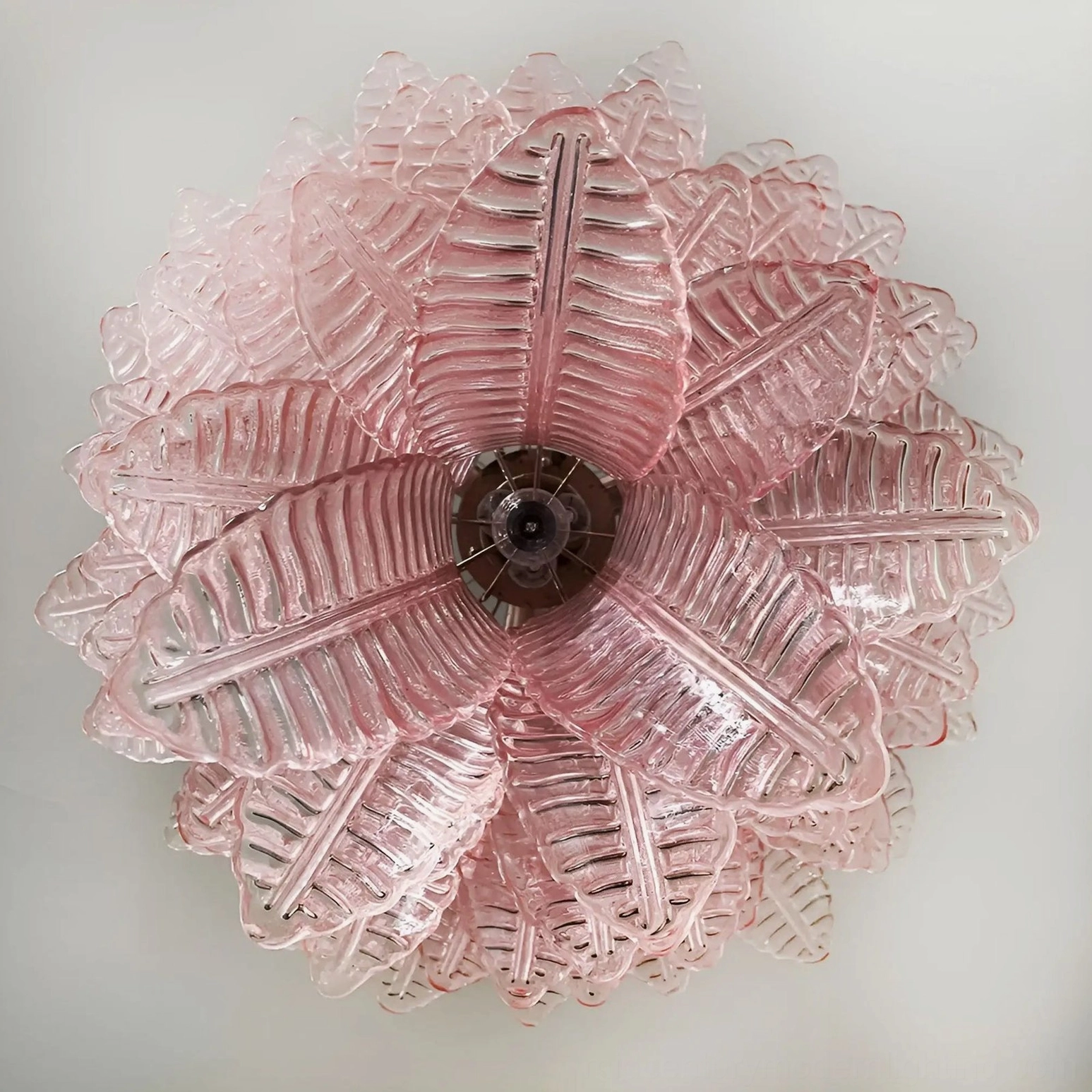 Radial pink glass leaf structure Murano chandelier close-up overhead flat composition