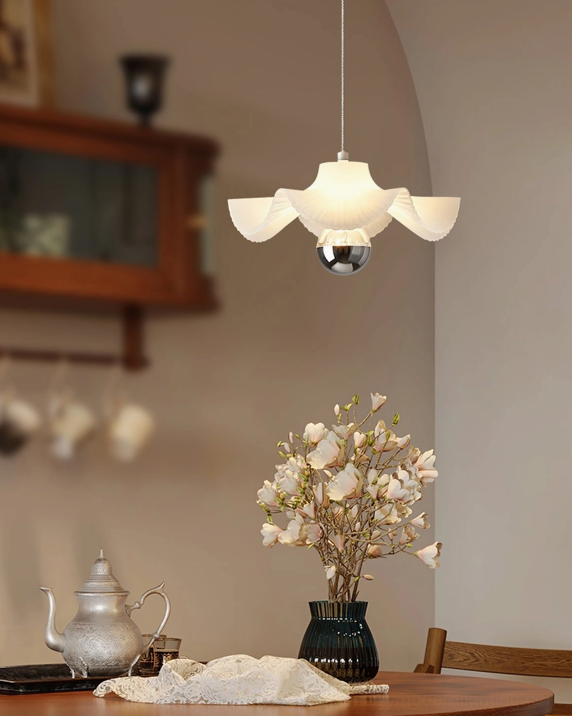 Radial pleated pendant light with polished metal base and three-color changing LED system