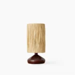Organic modernism raffia table lamp with walnut wood base, full front view on white background, studio lighting