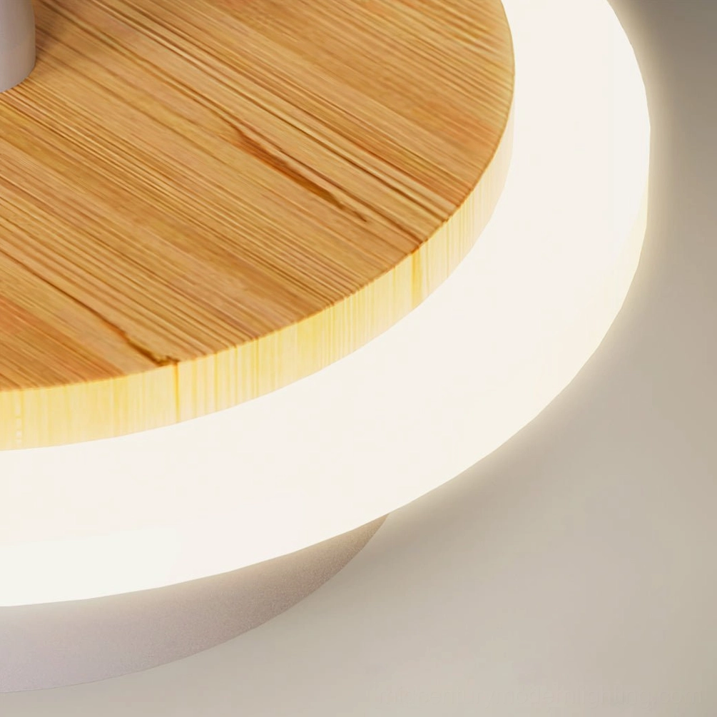 Ramen Wall Lamp base close-up - Top-down detail of natural wood grain circular back plate with LED ring trim