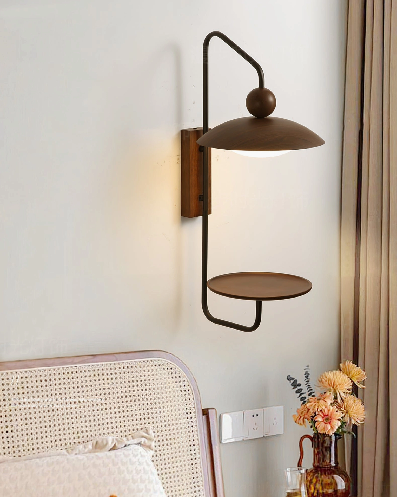 Rancho wall-mounted lamp in bedroom setting with rattan headboard, bohemian-modern styling