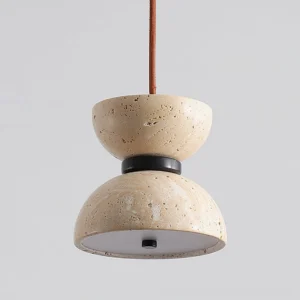 Close-up side view of Randolf natural stone pendant lamp showing layered travertine shade construction with black metal trim detail