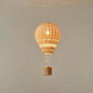 Rattan balloon pendant lighting fixture with exposed LED bulb showing woven basket texture detail