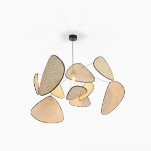 Handwoven rattan cluster pendant light with organic triangular shades and black metal frame, studio overhead view