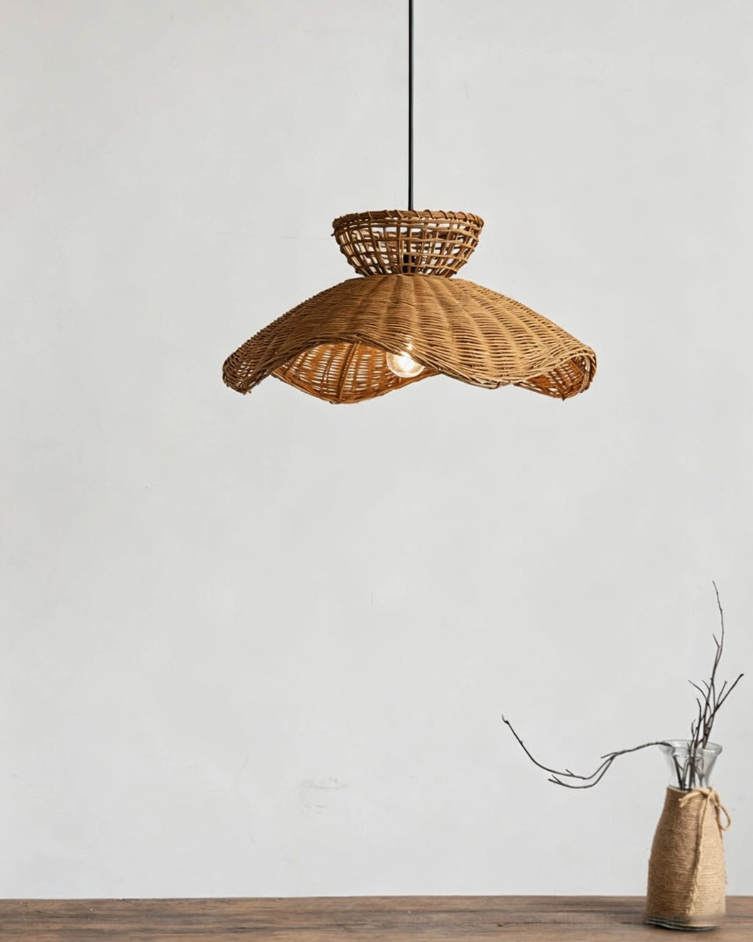 Rattan pendant light in bohemian rustic home setting with dried flowers, showcasing warm ambient glow