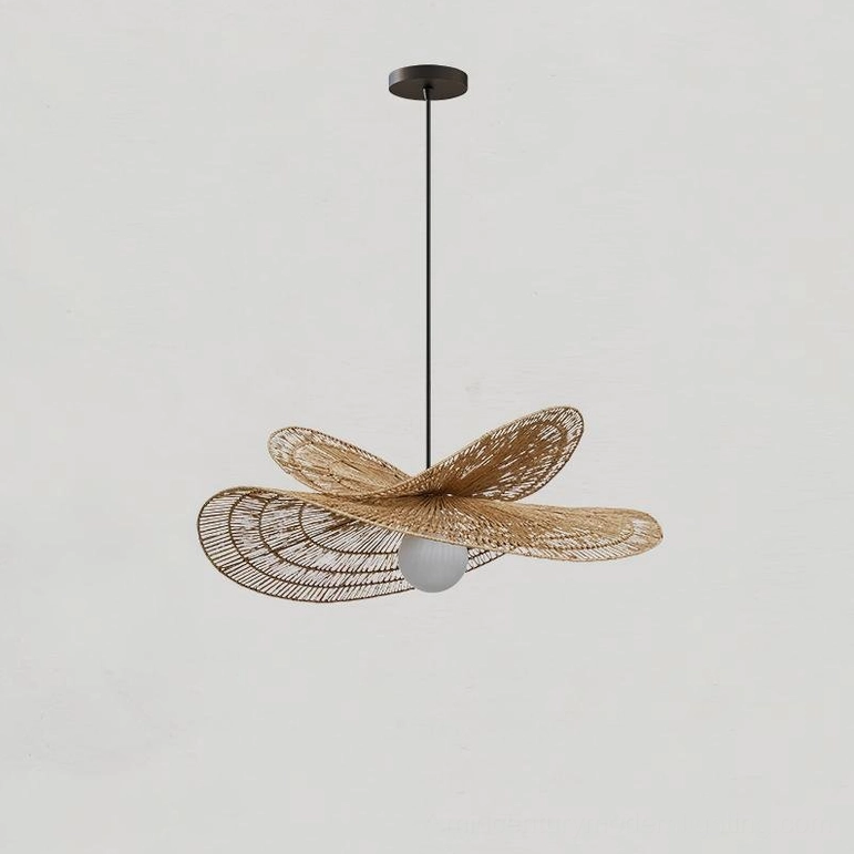 Natural rattan petal pendant fixture demonstrating organic weave pattern and mid-century modern aesthetic
