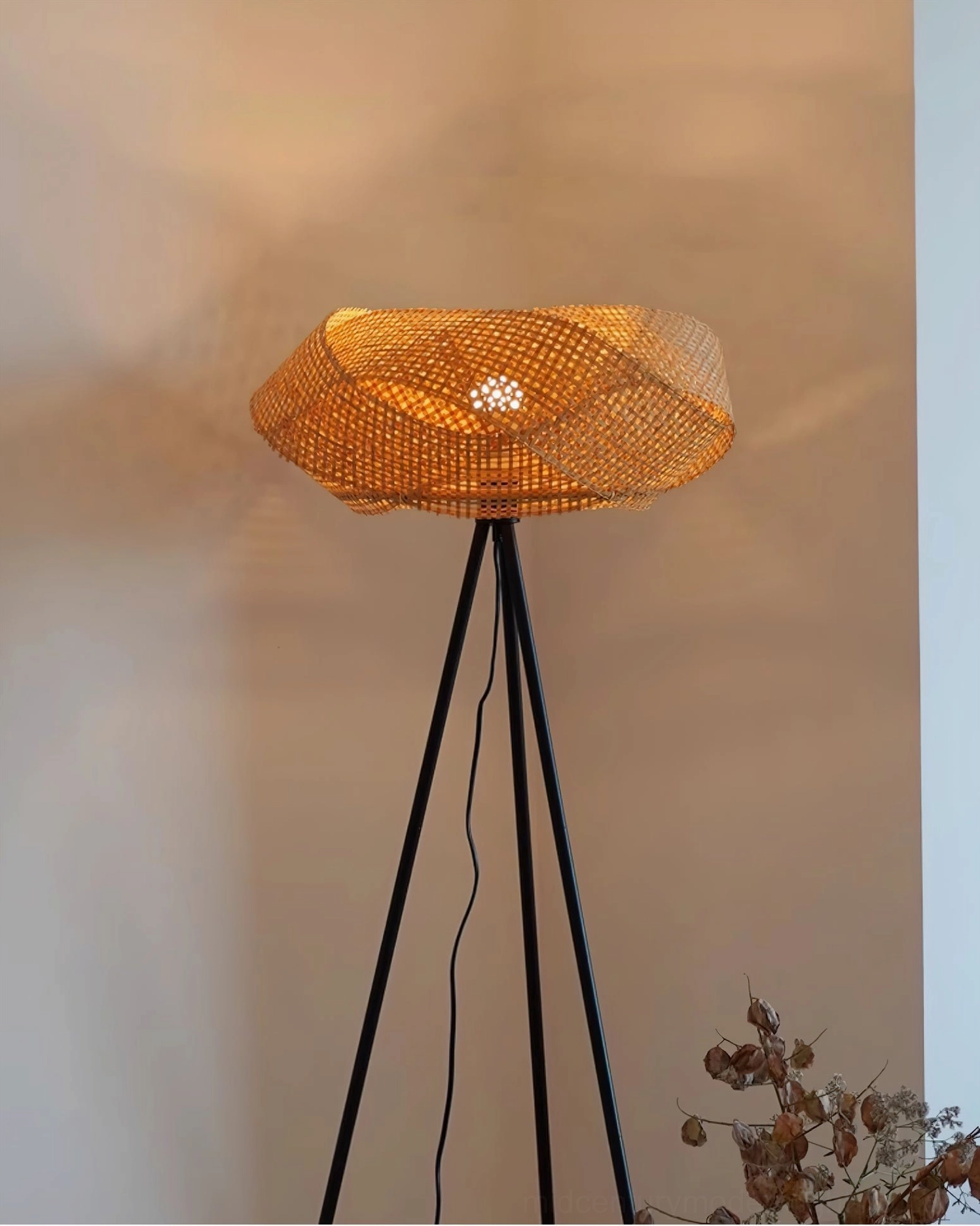 Hand-woven rattan floor lamp shade close-up, natural fiber texture and weave pattern with warm light diffusion