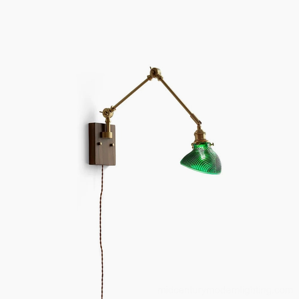 Rebell swing arm plug-in wall lamp with dark wood base and green ribbed glass shade, front studio view on white background