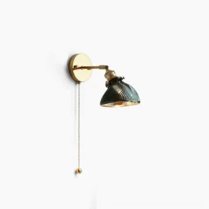 Rebell brass wall lamp with dark green ribbed glass shade, front studio view showcasing vintage industrial design