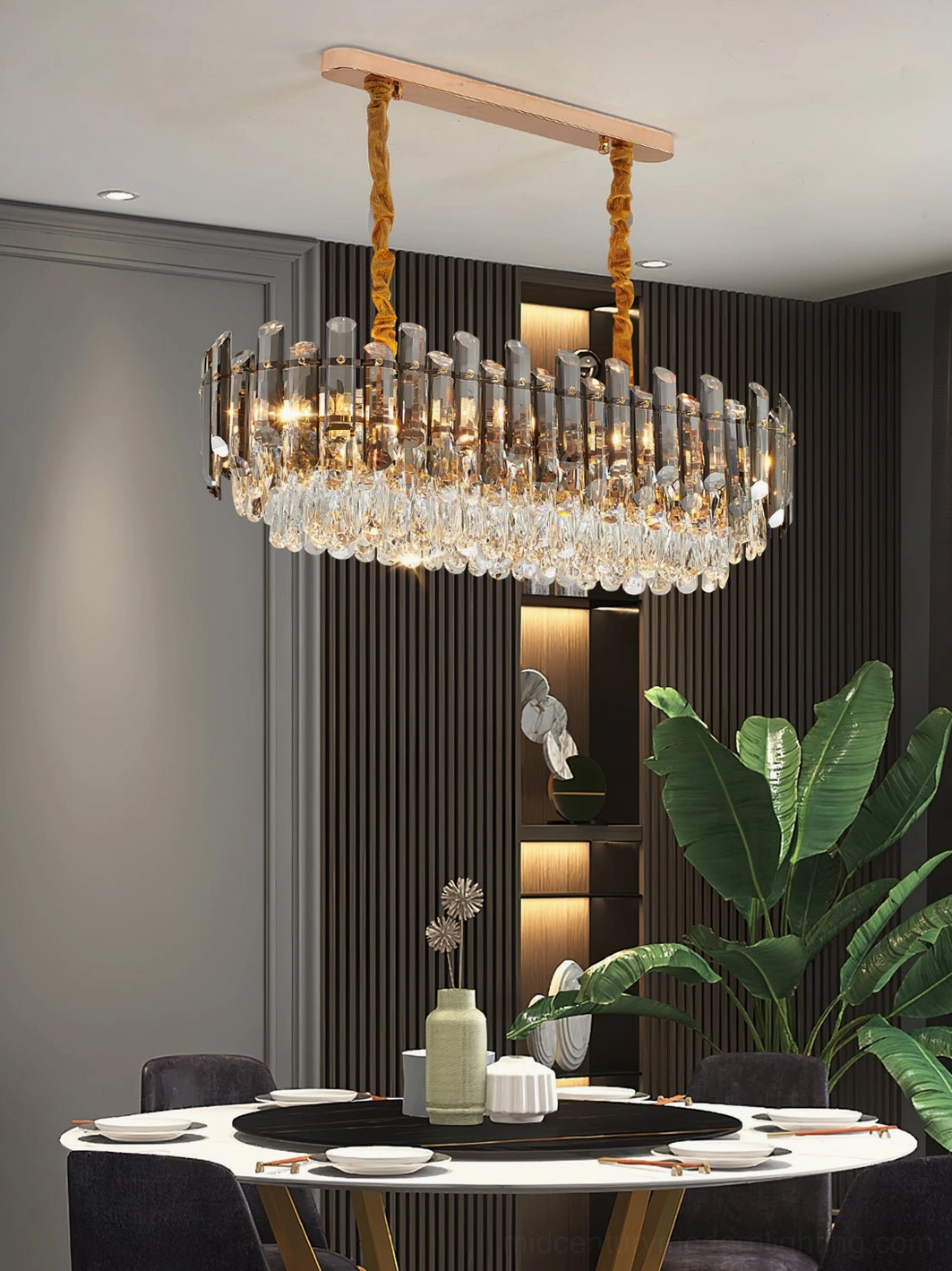 Rectangular modern crystal chandelier with three-quarter view showing gold hardware and tiered crystal design