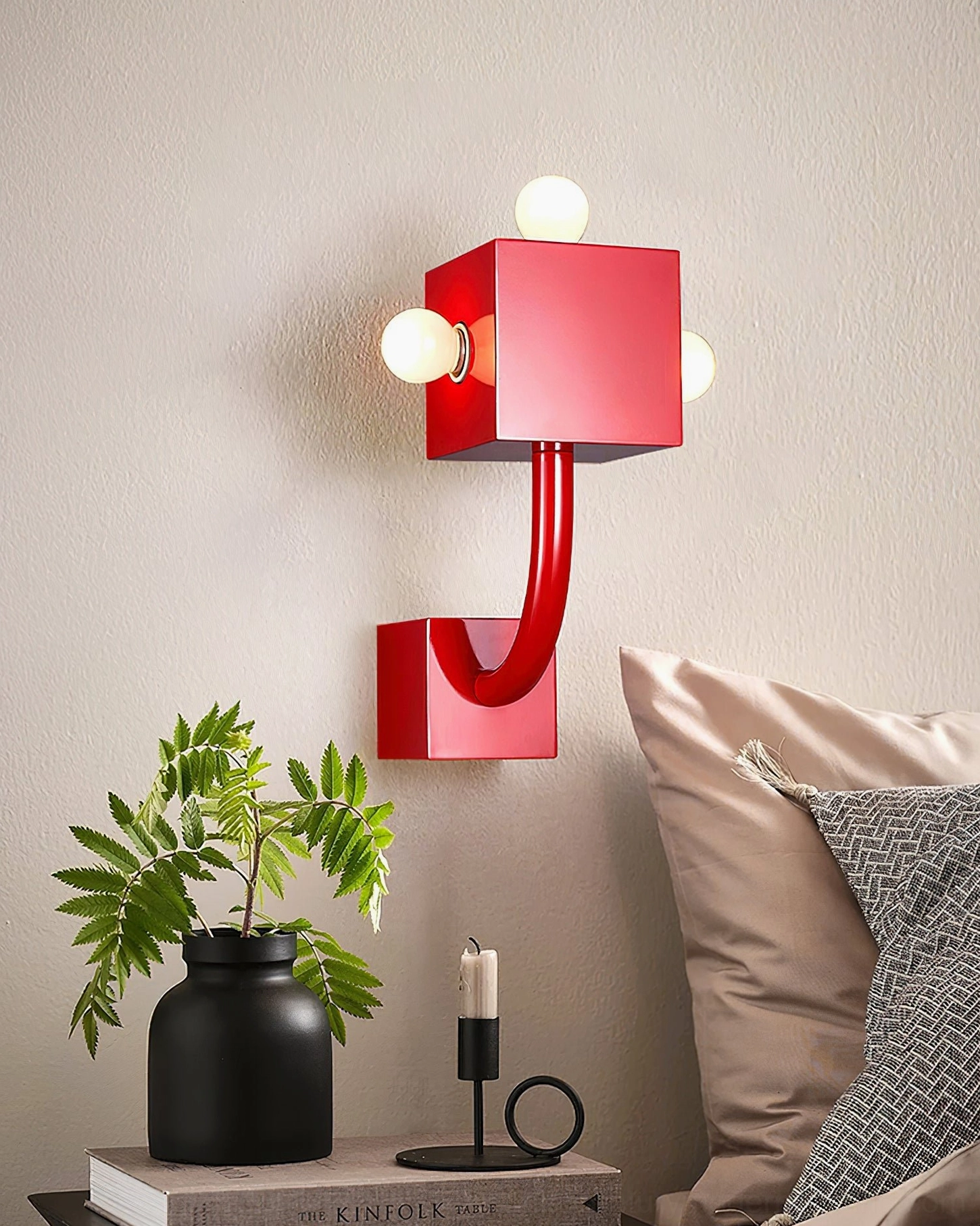Red cube wall lamp bedside lighting minimalist bedroom plants cushions