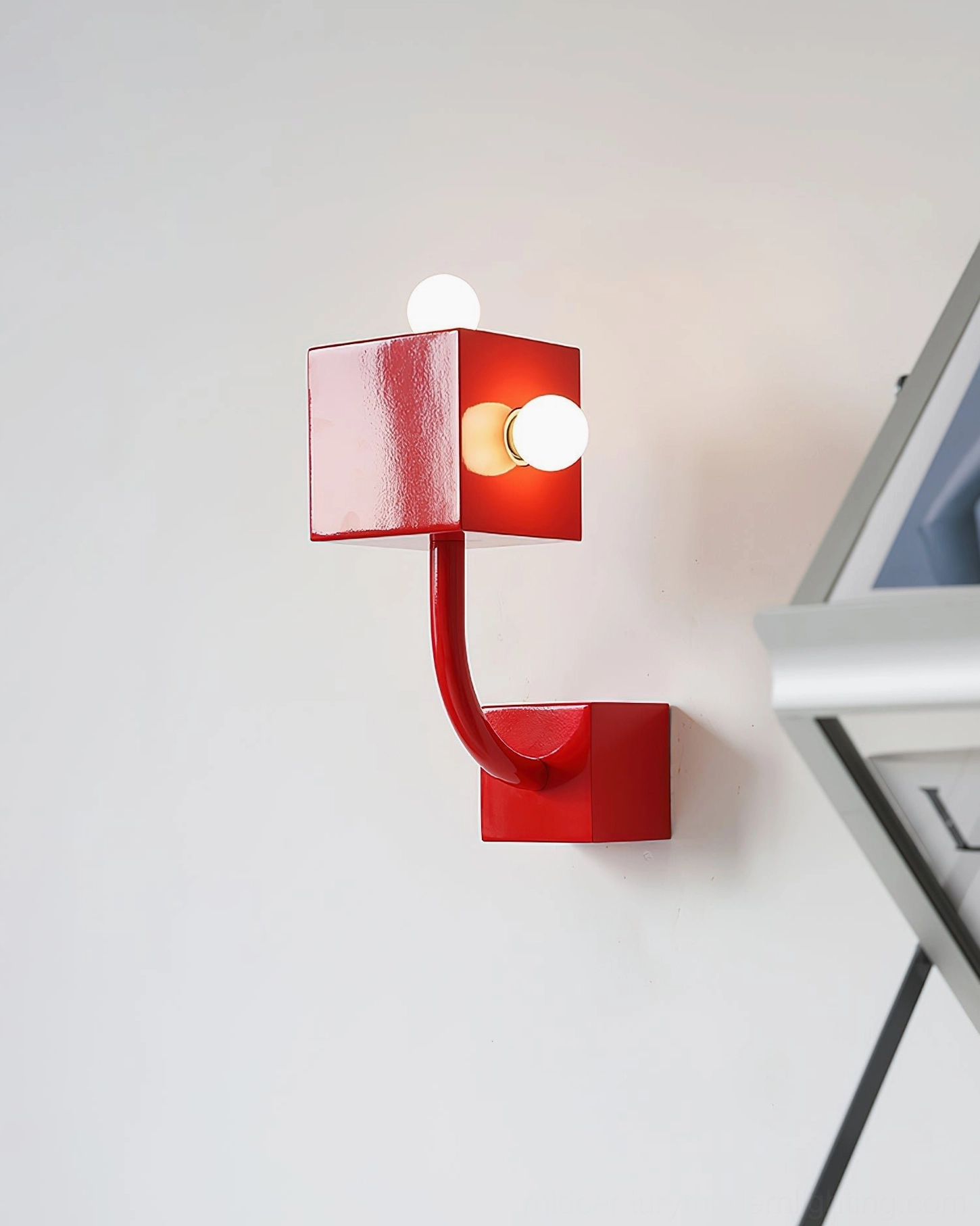 Red cube wall lamp corner installation with picture frame home accent lighting