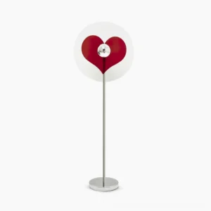 Red heart projection floor lamp with chrome metal pole on white studio background, showing clear acrylic shade with heart cutout detail