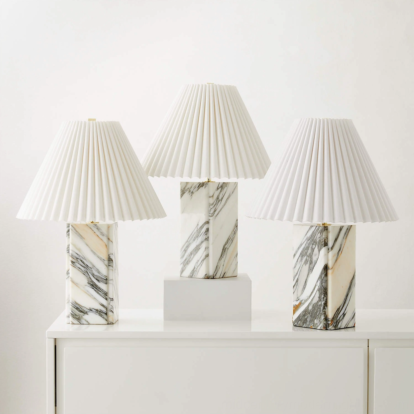 Bianca red marble table lamp warm glow highlighting geological stone patterns