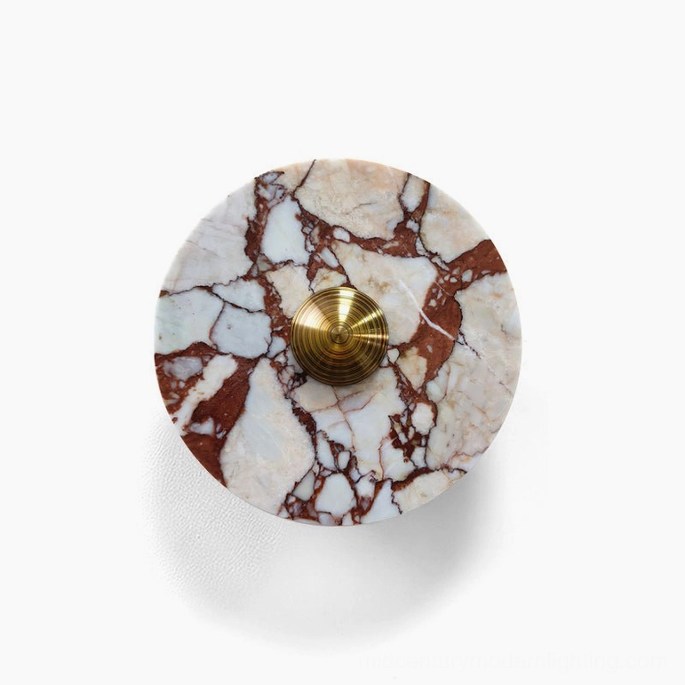 Red and white marble wall lamp with brass metalwork showing natural stone veining and luxury finish