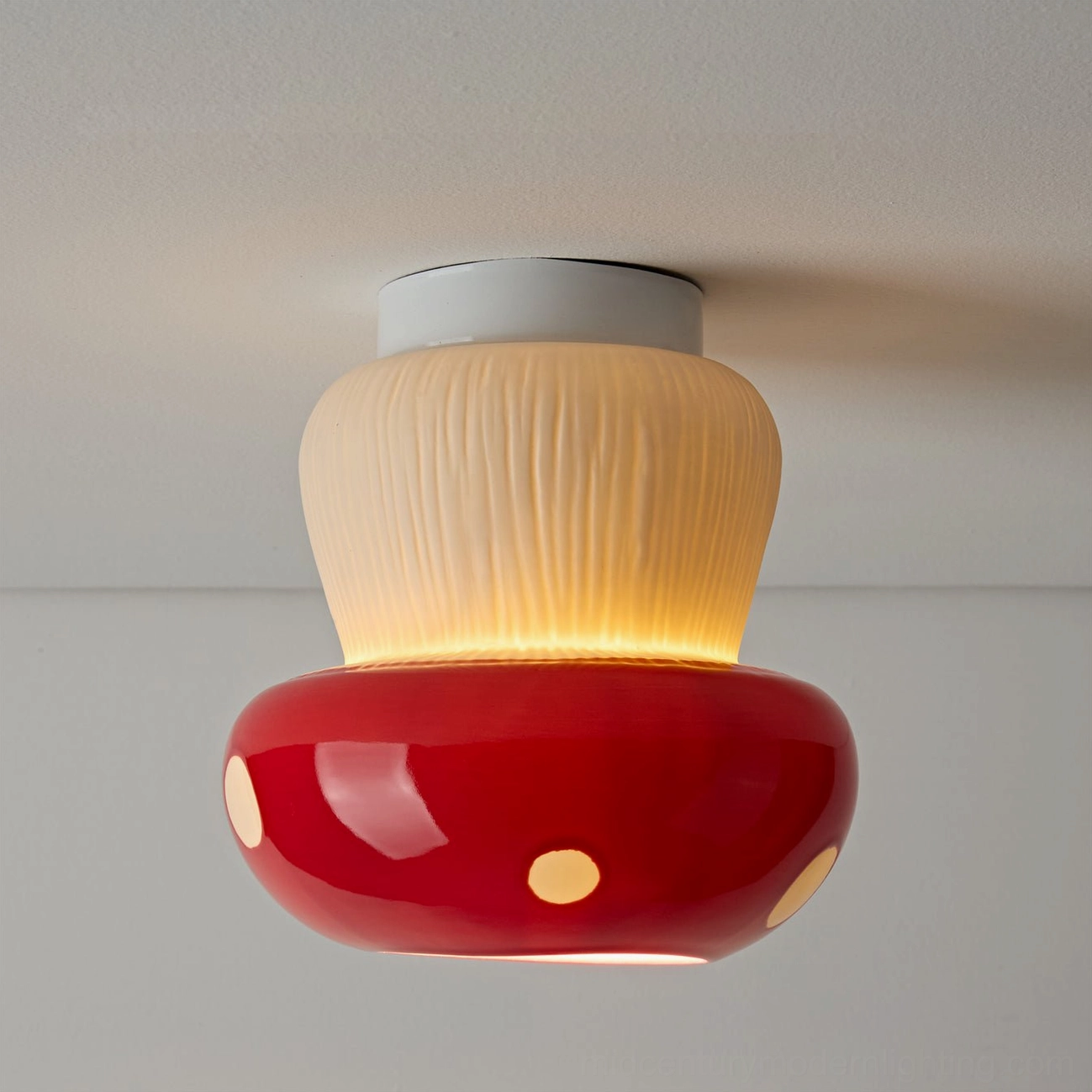 Large red mushroom ceiling light fixture showing scaled-up proportions and ceramic detail