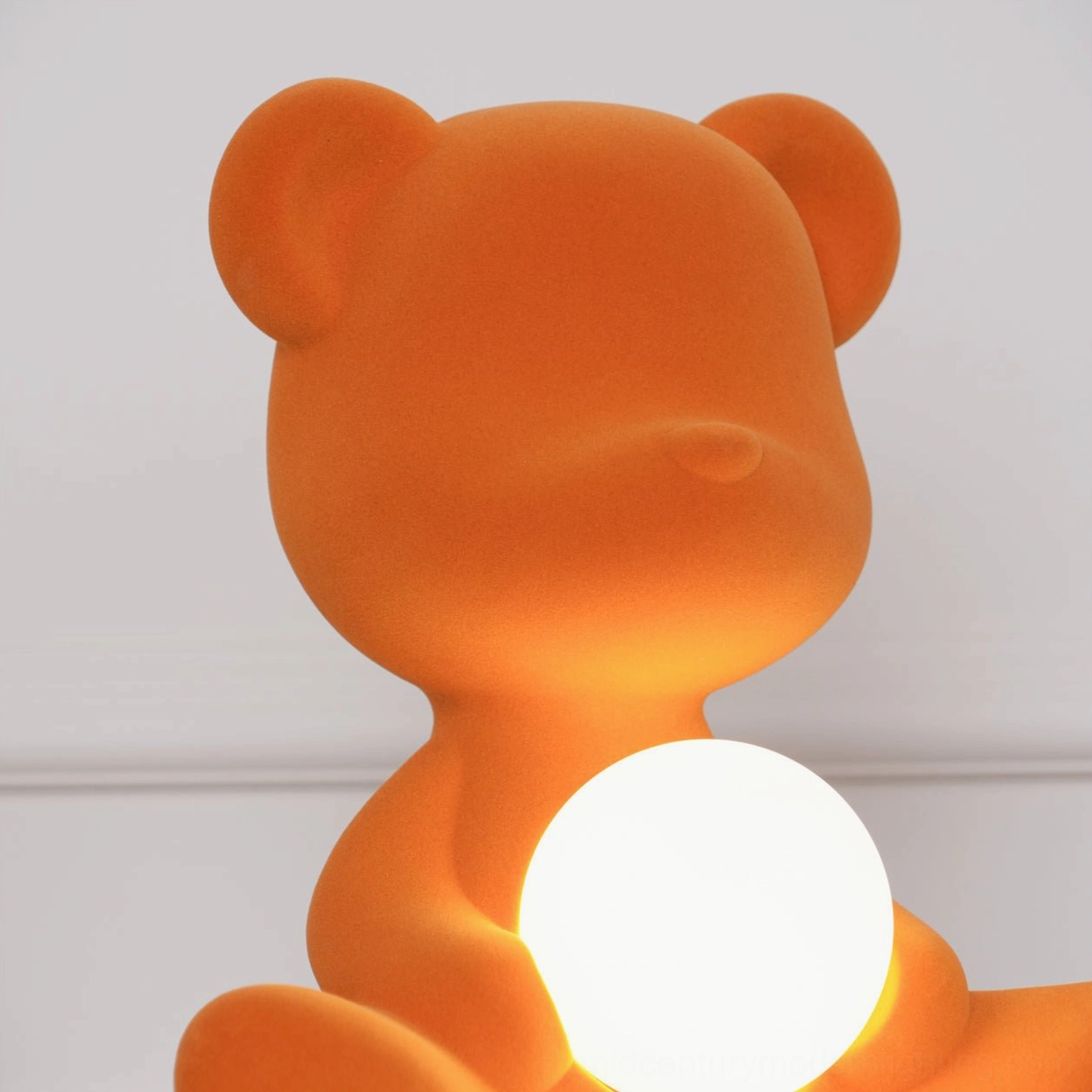 Red teddy bear table lamp with illuminated spherical belly light feature