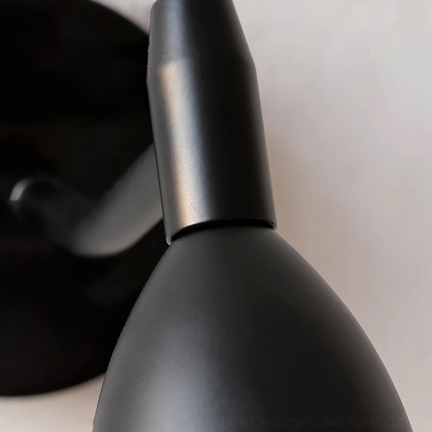 Reese spherical wall lamp product detail shot showcasing frosted glass shade and black metal construction