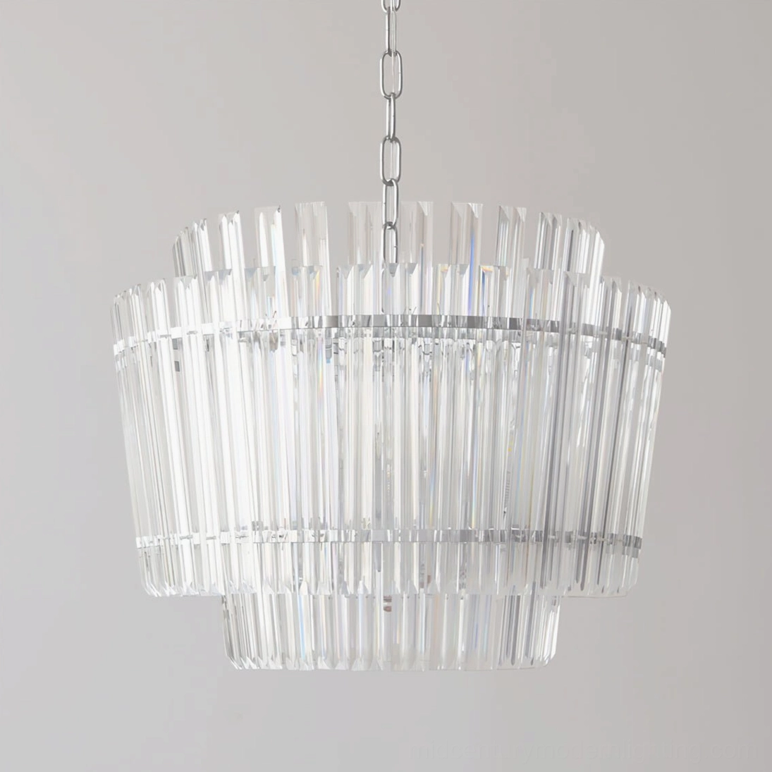 Close-up front view of Regina chandelier displaying double-tiered striated glass tubes and polished chrome frame detail