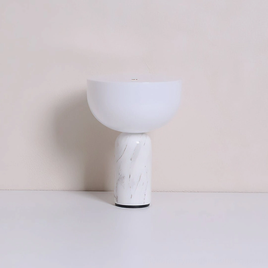 Renard marble table lamp base close-up showing natural veining pattern of Rosso Levanto stone