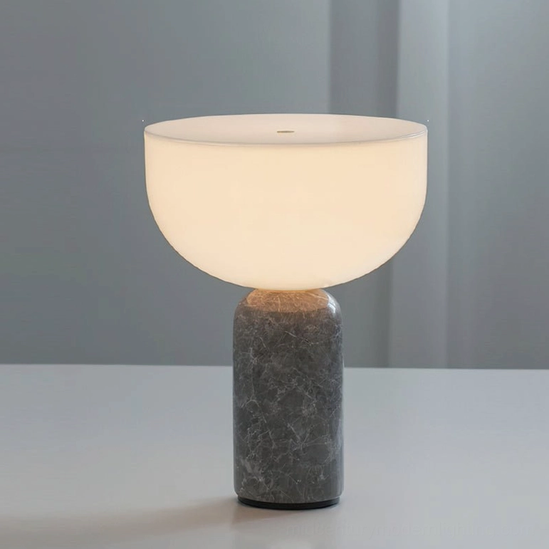 Renard marble lamp grey and white finish with warm glowing frosted glass on nightstand