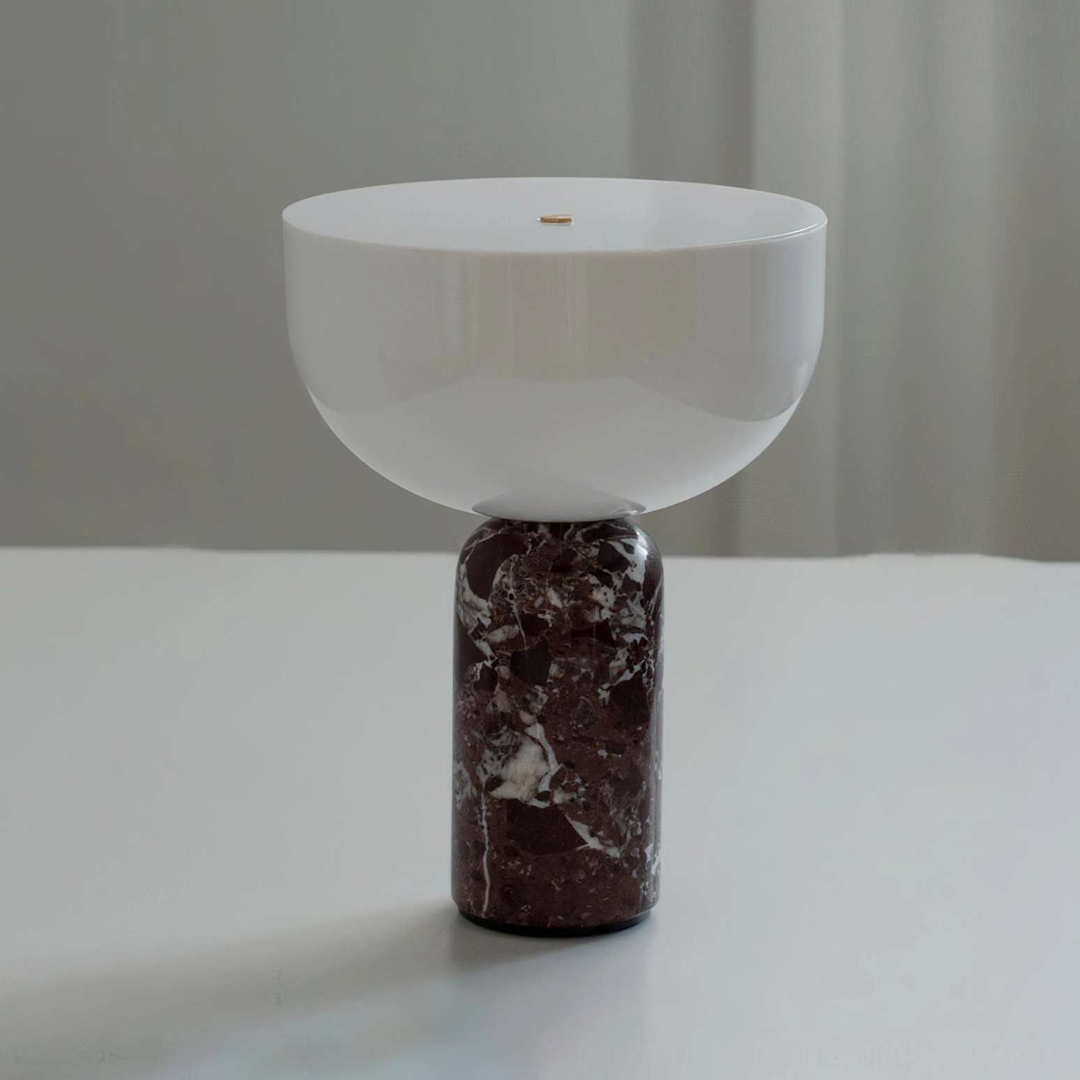 Renard marble lamp three quarter angle view showing sculptural base and glass diffuser proportion