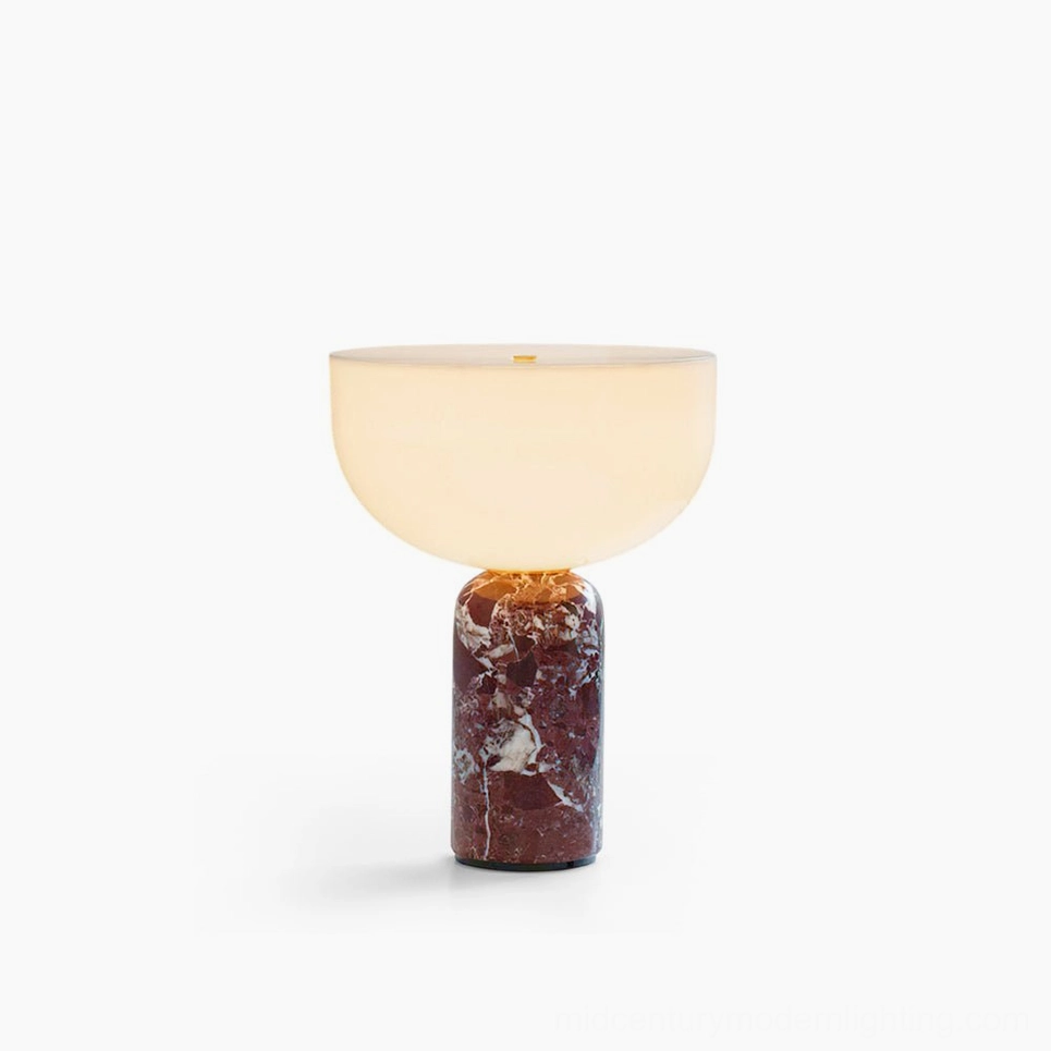Renard marble table lamp with reddish brown Rosso Levanto base and frosted glass shade on white studio background