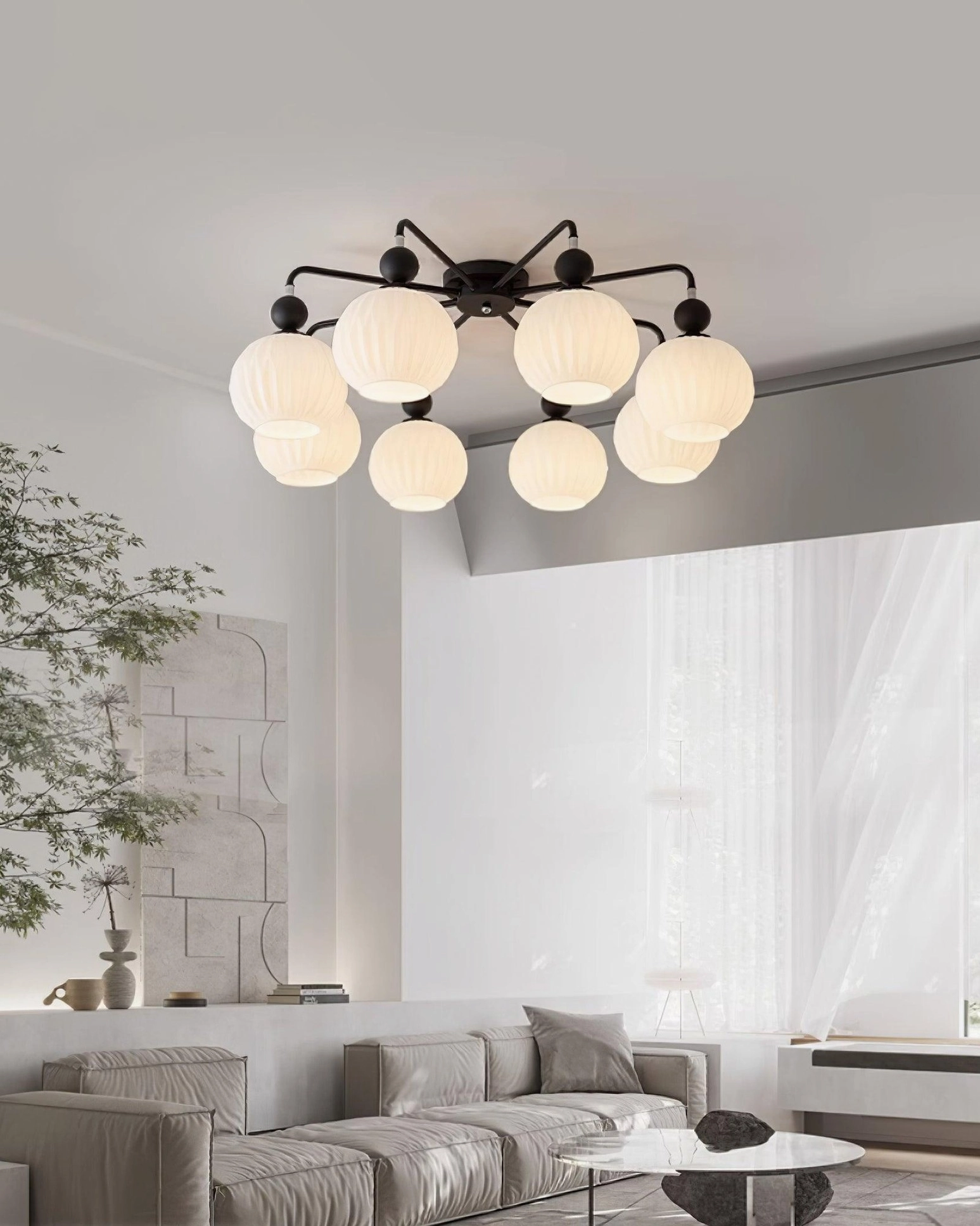 8-head matte black modern ceiling chandelier installed in minimalist living room, wide overhead shot