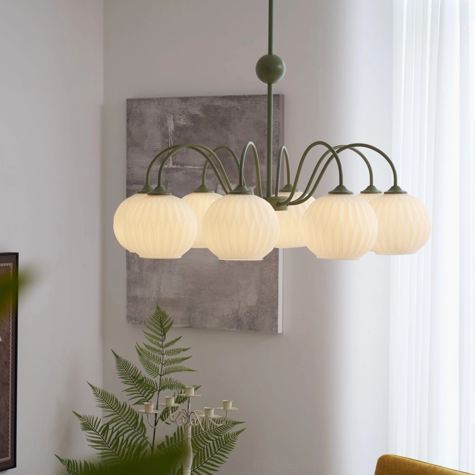 Renee globe chandelier installation in dining area showing warm ambient lighting and room illumination