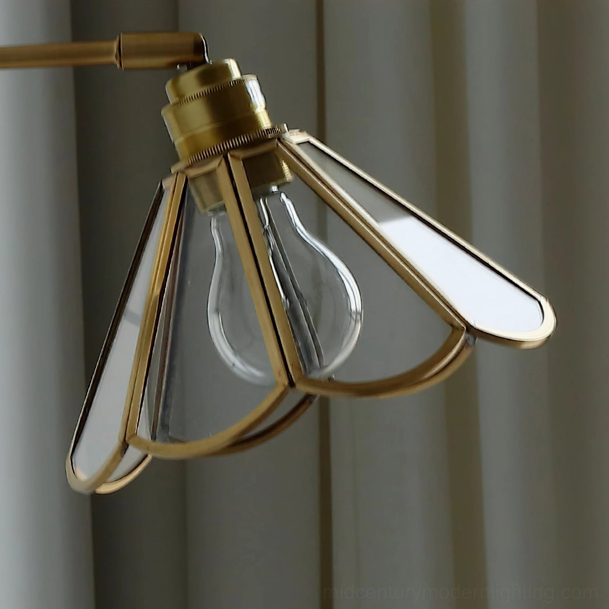 Rennes wall sconce shade close-up brass frame glass panels bulb socket