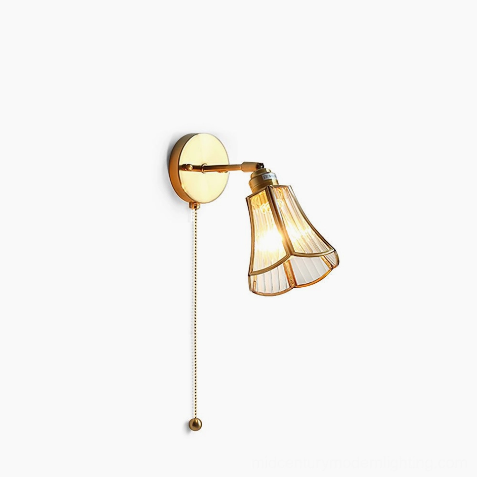 Rennes brass wall sconce with petal-shaped glass shade front view studio