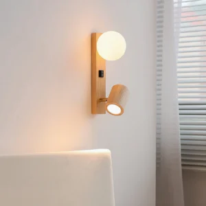 Rensen wall lamp installed in corner bedroom setting with window blinds and sofa, displaying natural wood finish and glass globe diffuser in contemporary interior design