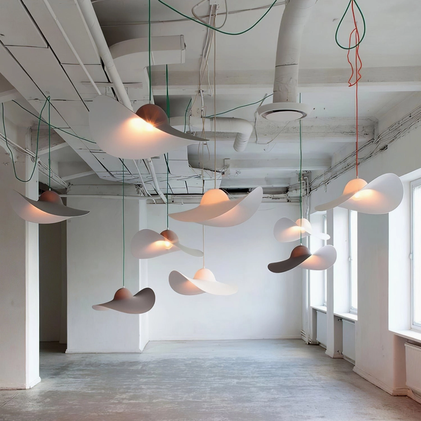 Resin hat pendant light showing clean curved form and matte finish