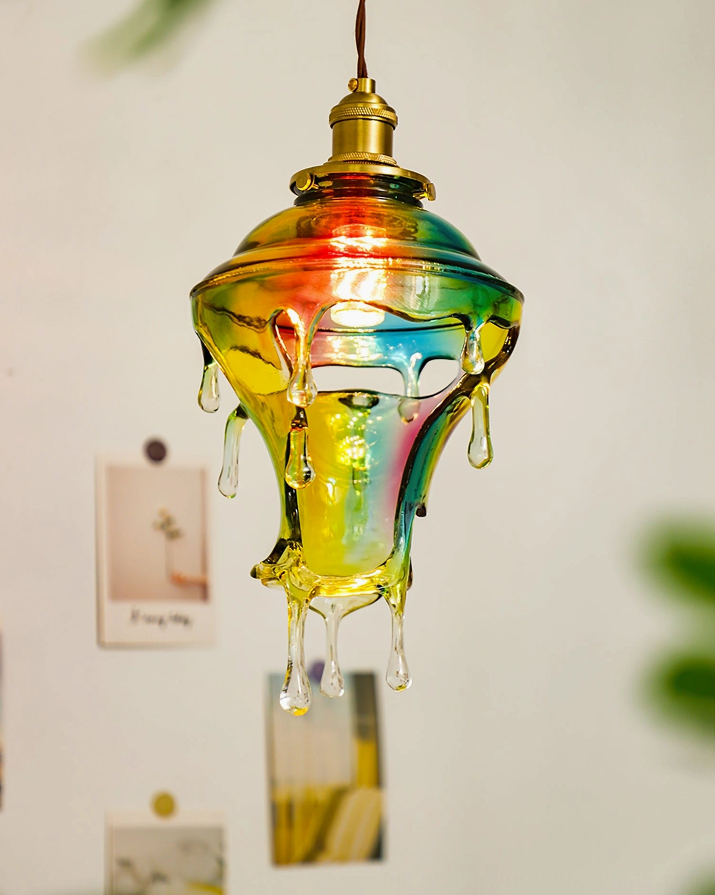 Atmospheric shot of resin water droplets pendant creating soft ambient lighting in home interior