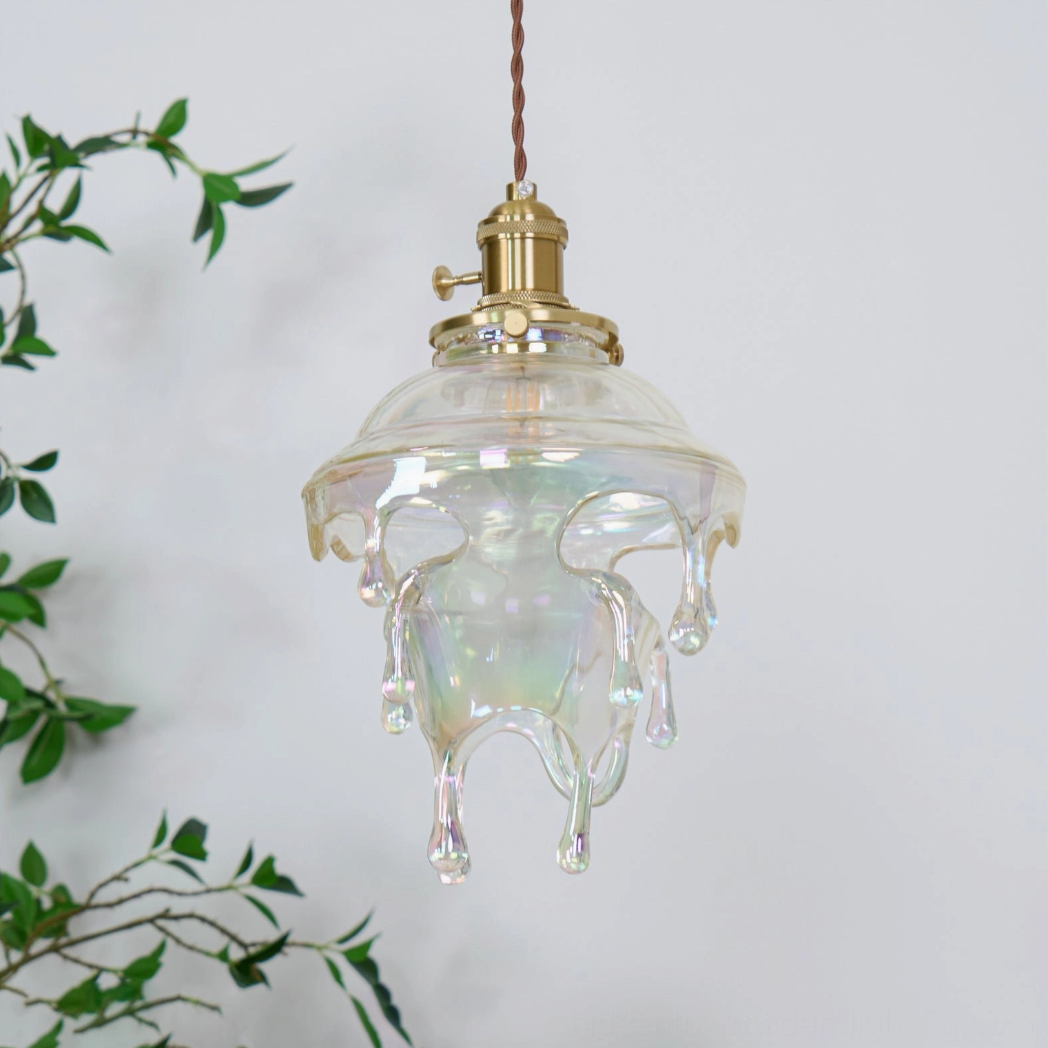 Multiple angles of water droplets resin pendant demonstrating unique artisanal variations