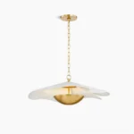Ressi modern pendant light with white layered fabric shade and polished brass accents, front overhead view against white studio background