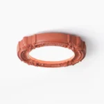 Ornate retro carved ceiling lamp with floral relief design, terracotta finish, studio flat lay view