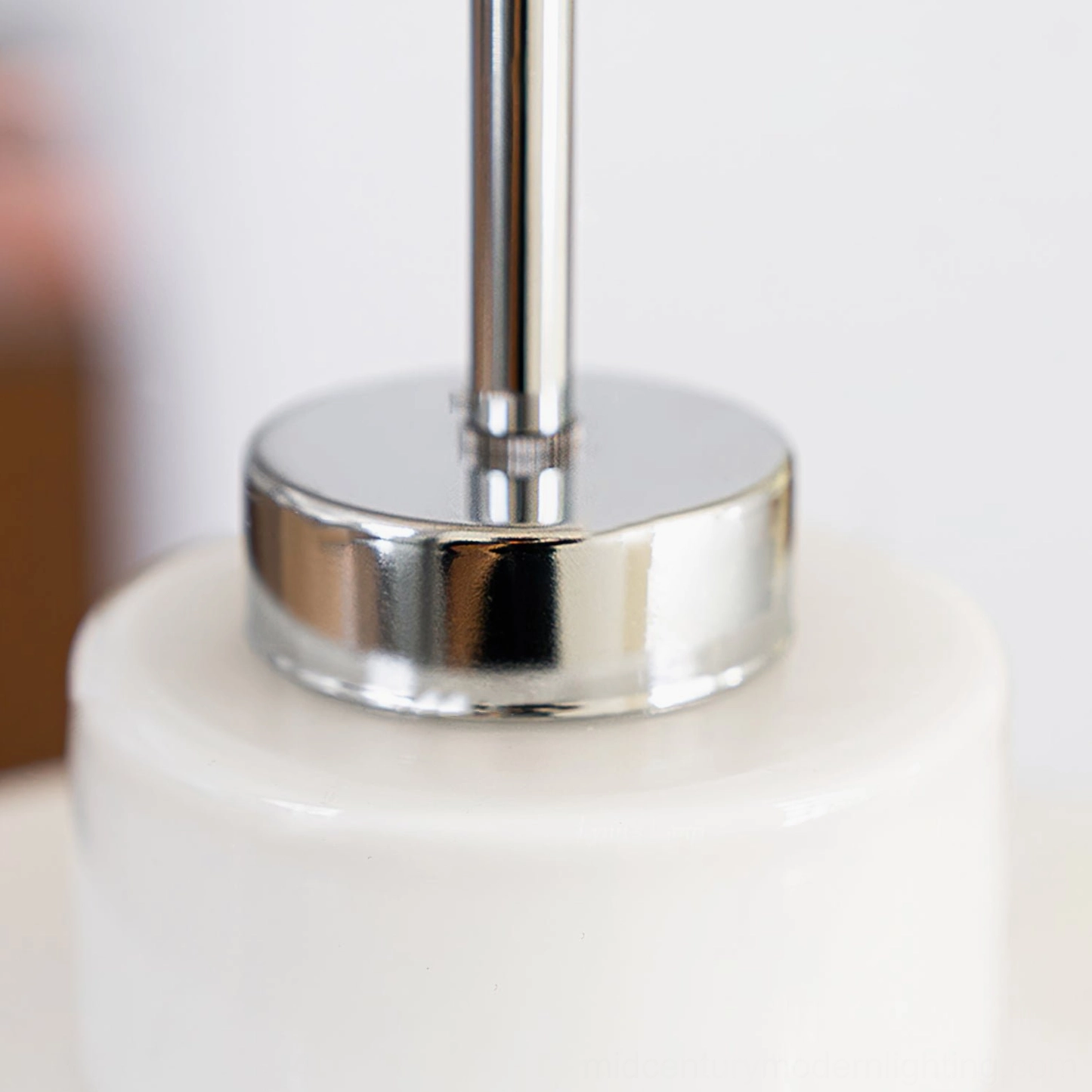 Close-up detail of polished chrome metal hardware and ceiling canopy mounting for Retro Circle pendant light fixture