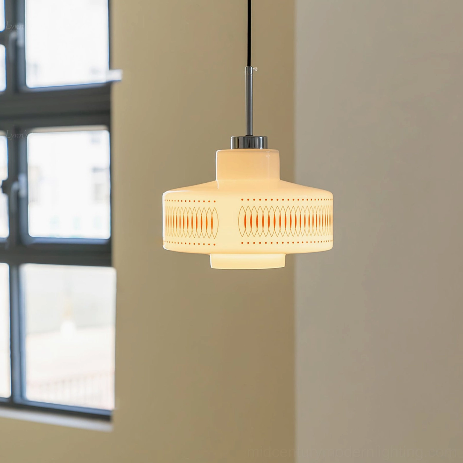 Illuminated Retro Circle pendant light glowing warm yellow through geometric pattern, 1970s-inspired ambient lighting effect