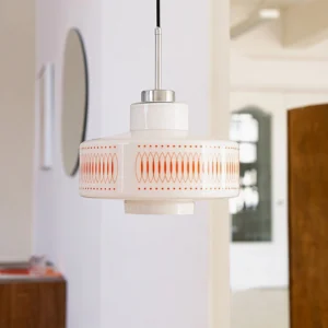 Single Retro Circle pendant suspended in contemporary entryway with polished chrome hanging rod, 1970s-inspired geometric lighting