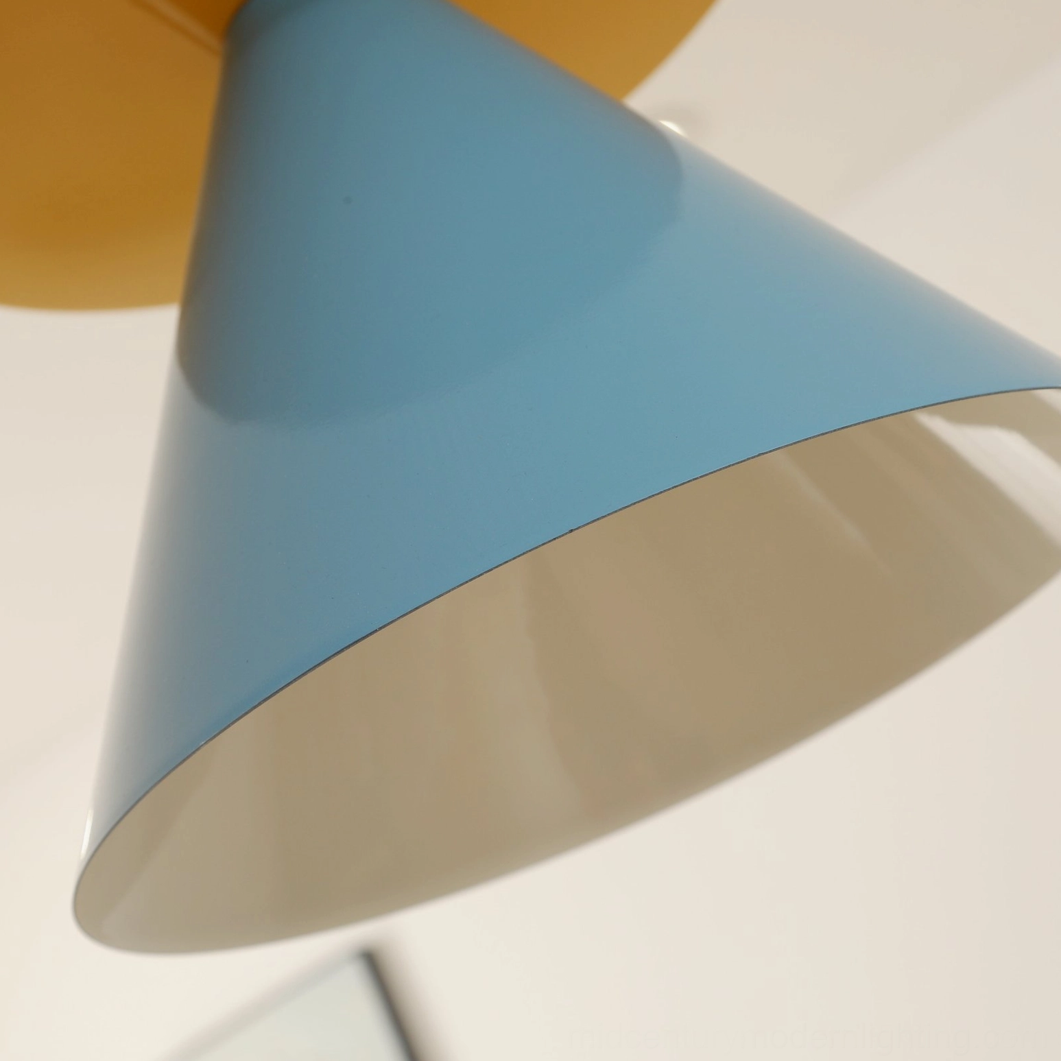 Retro modern striped pendant light detail showing color-blocking design and polished chrome mounting hardware