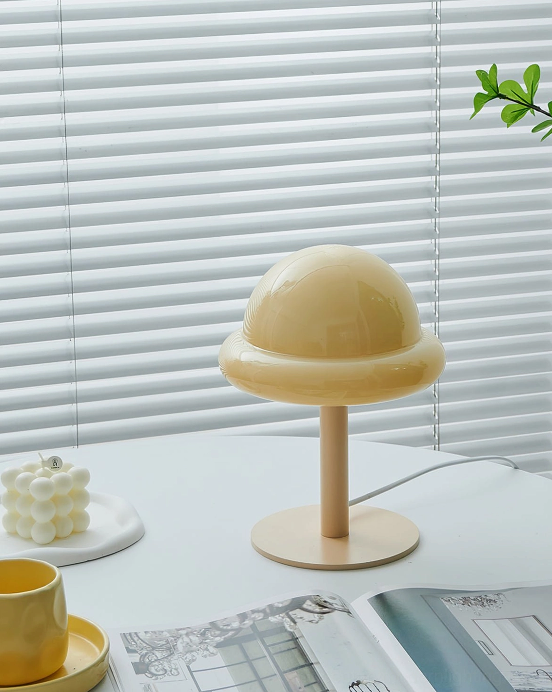 Space age mushroom dome lamp three-quarter view showing curved glass shape and metal frame