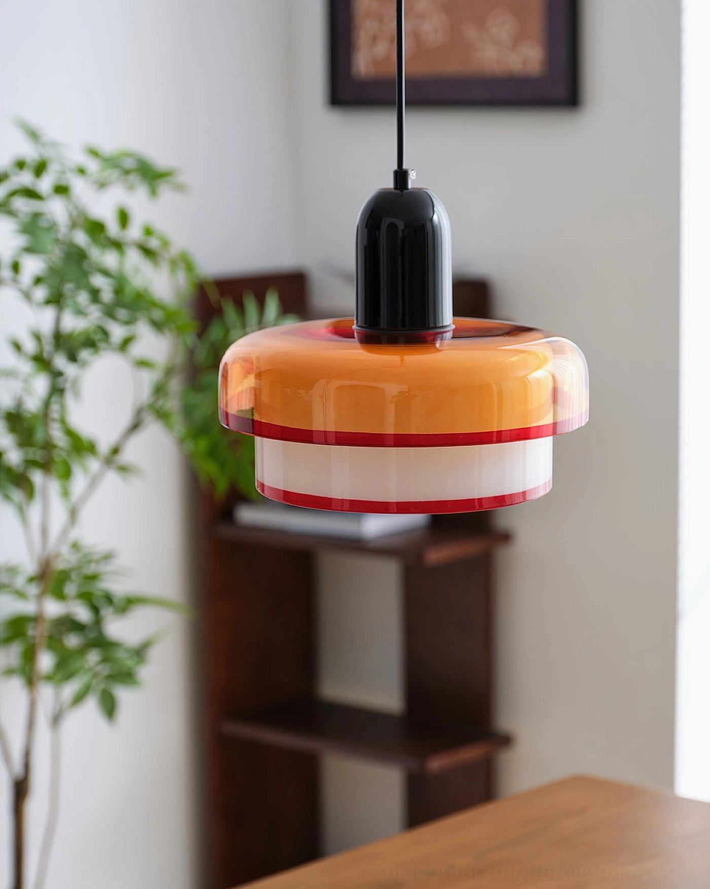 Compact retro color-block pendant lamp with black ceiling mount and potted plant decor