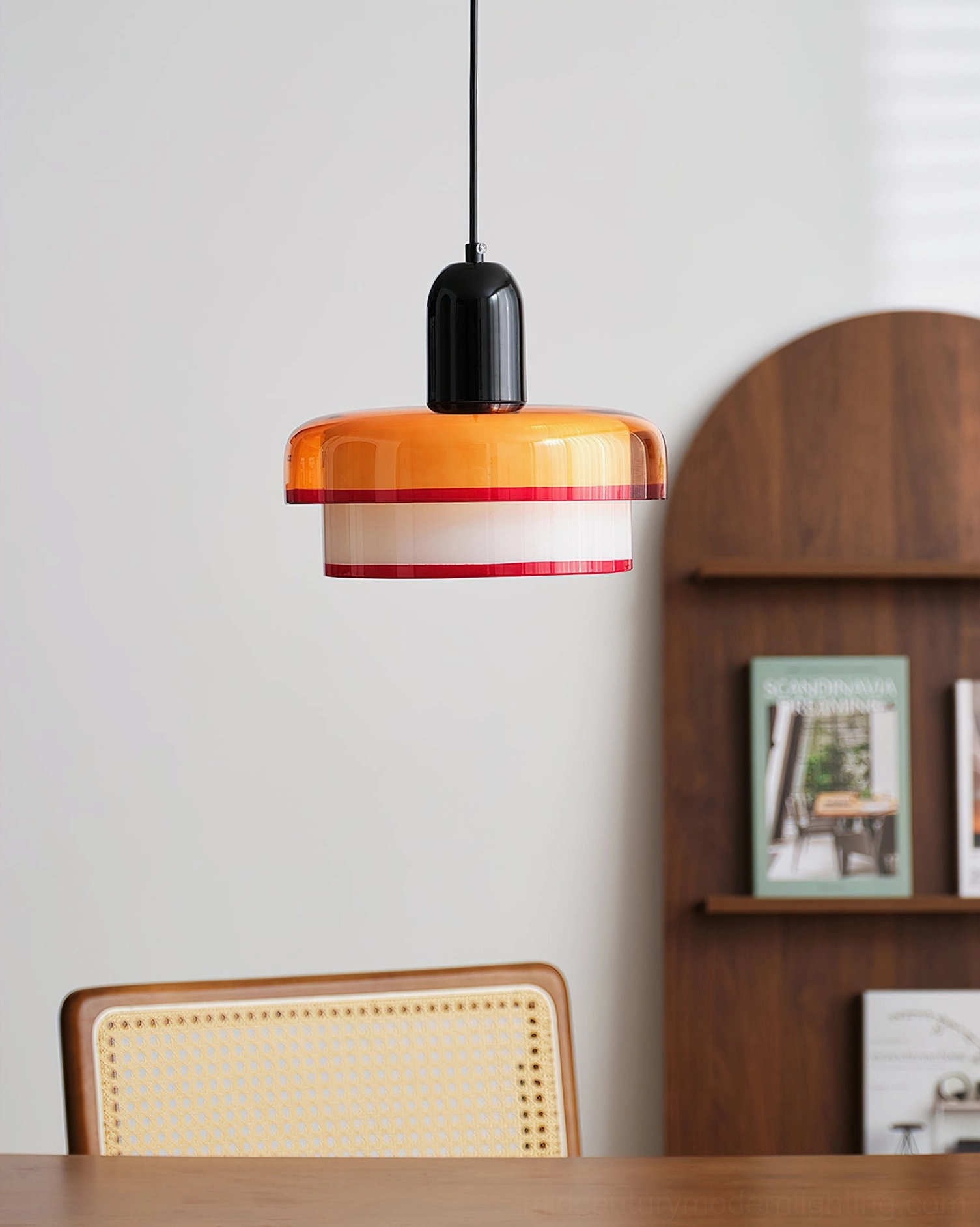 Side view of retro pendant fixture with color-block design in rattan dining area