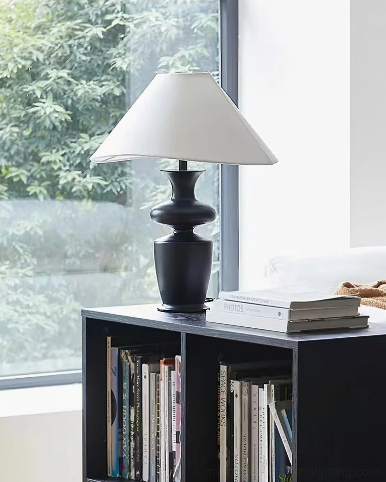 Rhodes sculptural table lamp front perspective with asymmetrical shade and wooden base construction