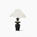 Rhodes mid-century modern table lamp with sculptural black wood base and asymmetrical white fabric shade, studio product shot